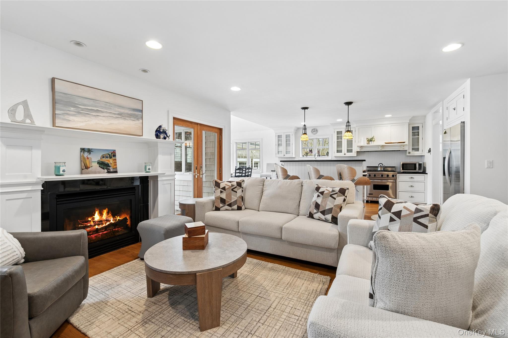 10 Foxboro Road East Quogue, NY 11946 - Photo 8 of 31 a living room with furniture and a fireplace