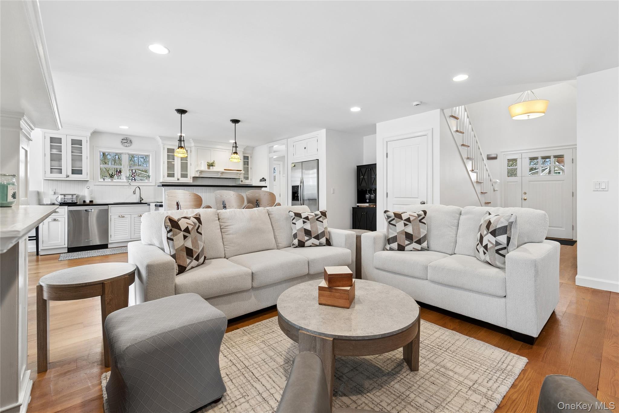 10 Foxboro Road East Quogue, NY 11946 - Photo 9 of 31 a living room with furniture and a view of kitchen