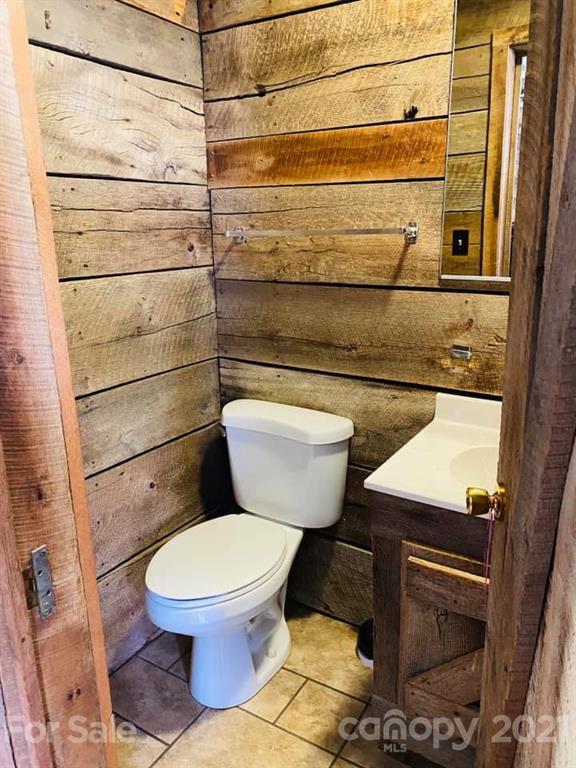 217 Powell Road Clyde, NC 28721 - Photo 22 of 48 a bathroom with a toilet and a shower