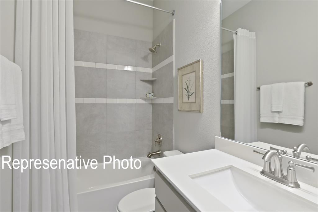 331 Fire Blade Drive Aledo, TX 76008 - Photo 17 of 17 Bathroom featuring a vanity with an integrated sink, brushed nickel faucet, and a large mirror
