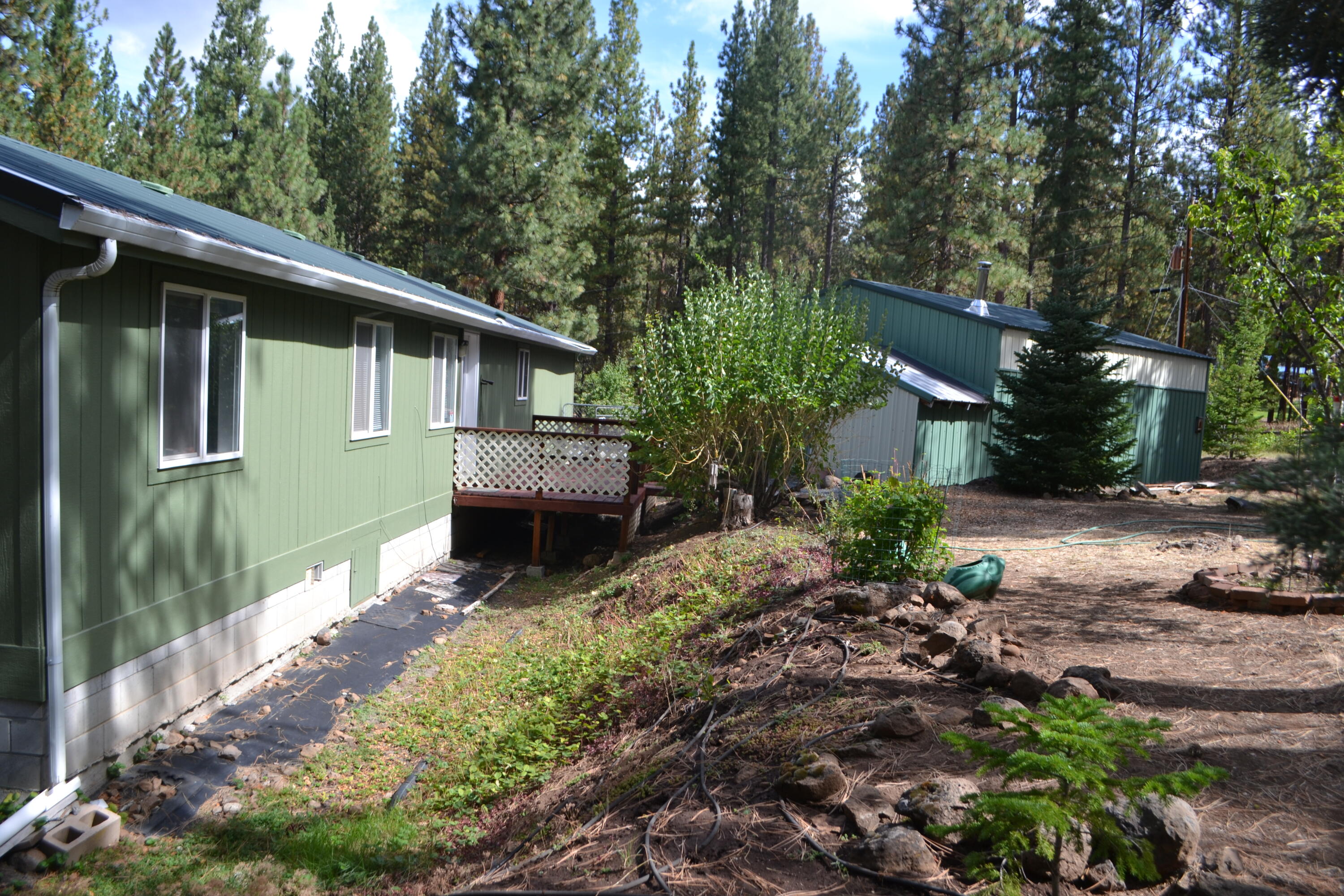 34 Hideaway Lane Adin, CA 96006 - Photo 17 of 26 a front view of a house with garden