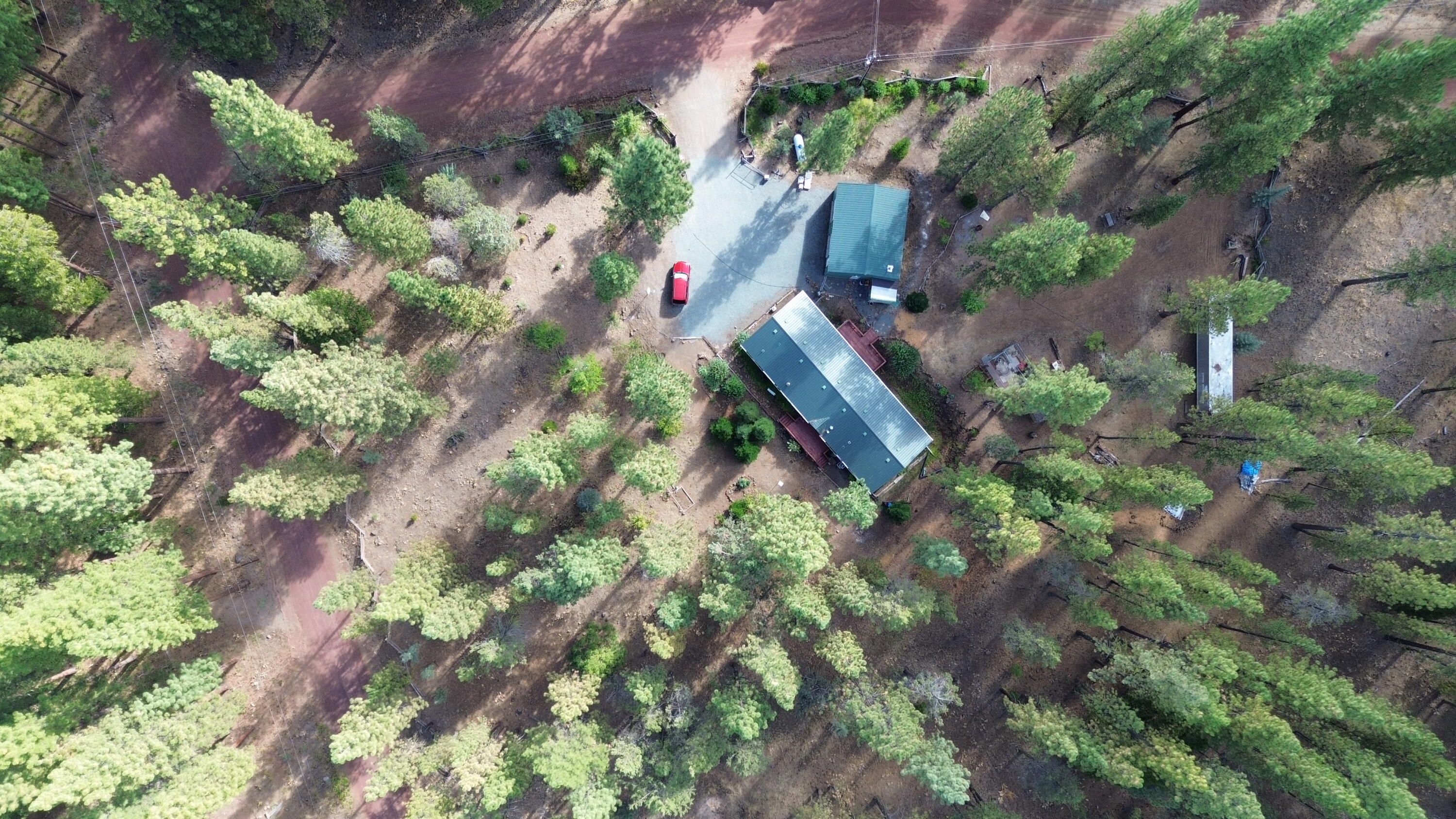 34 Hideaway Lane Adin, CA 96006 - Photo 19 of 26 an aerial view of a house with a yard and garden