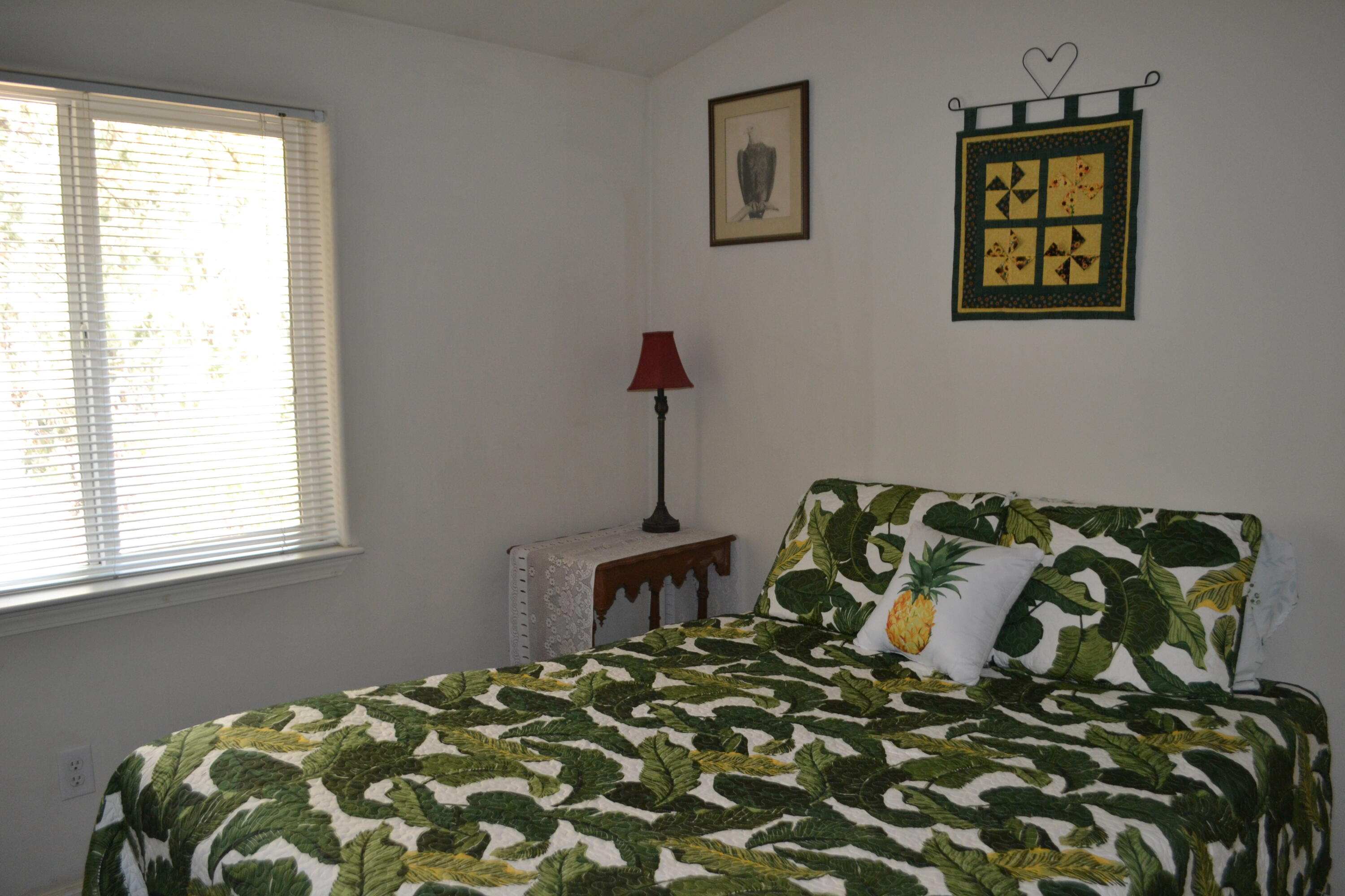 34 Hideaway Lane Adin, CA 96006 - Photo 7 of 26 a bed sitting in a bedroom next to a window