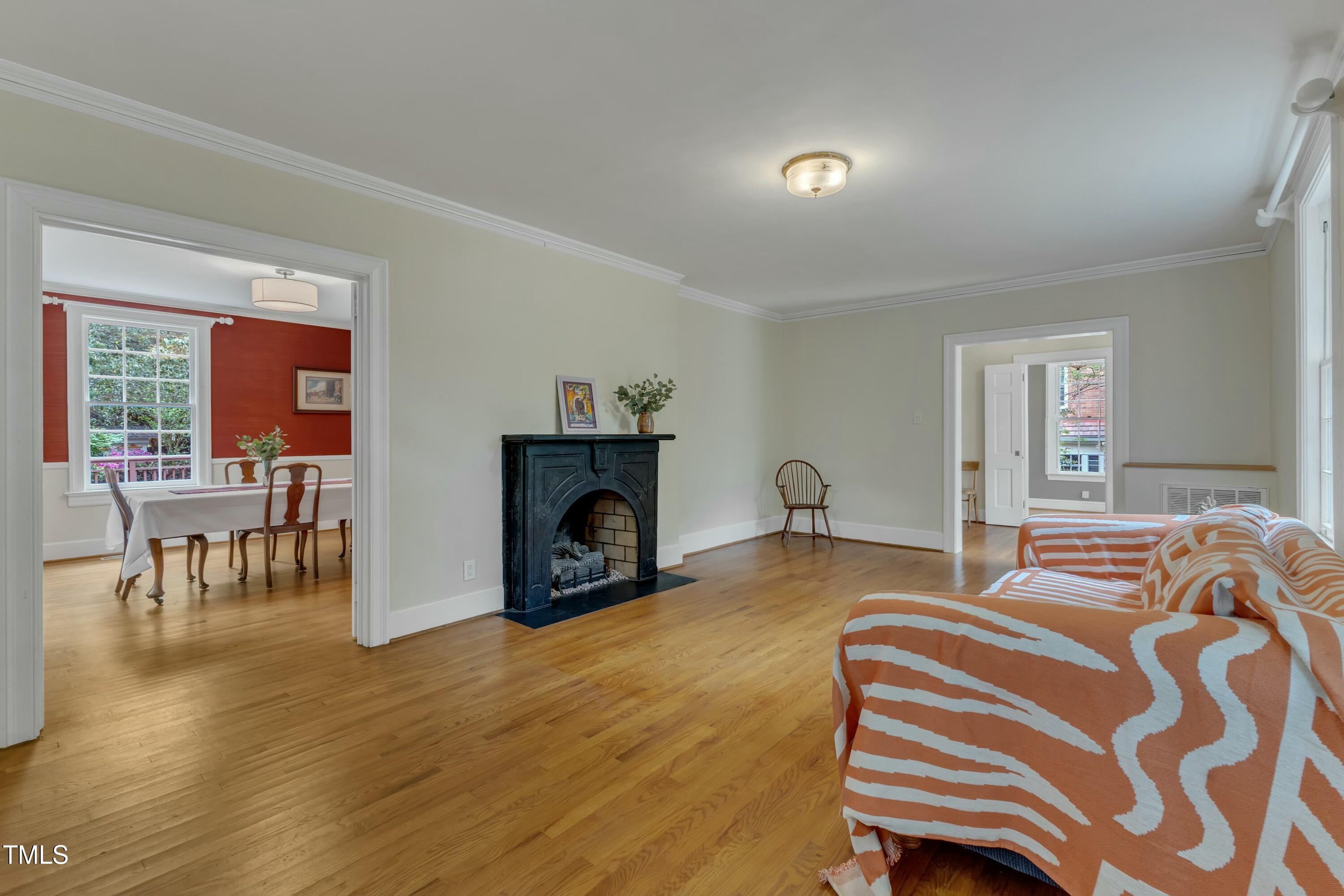 2625 Dover Road Raleigh, NC 27608 - Photo 12 of 90 a spacious bedroom with a bed and wooden floor