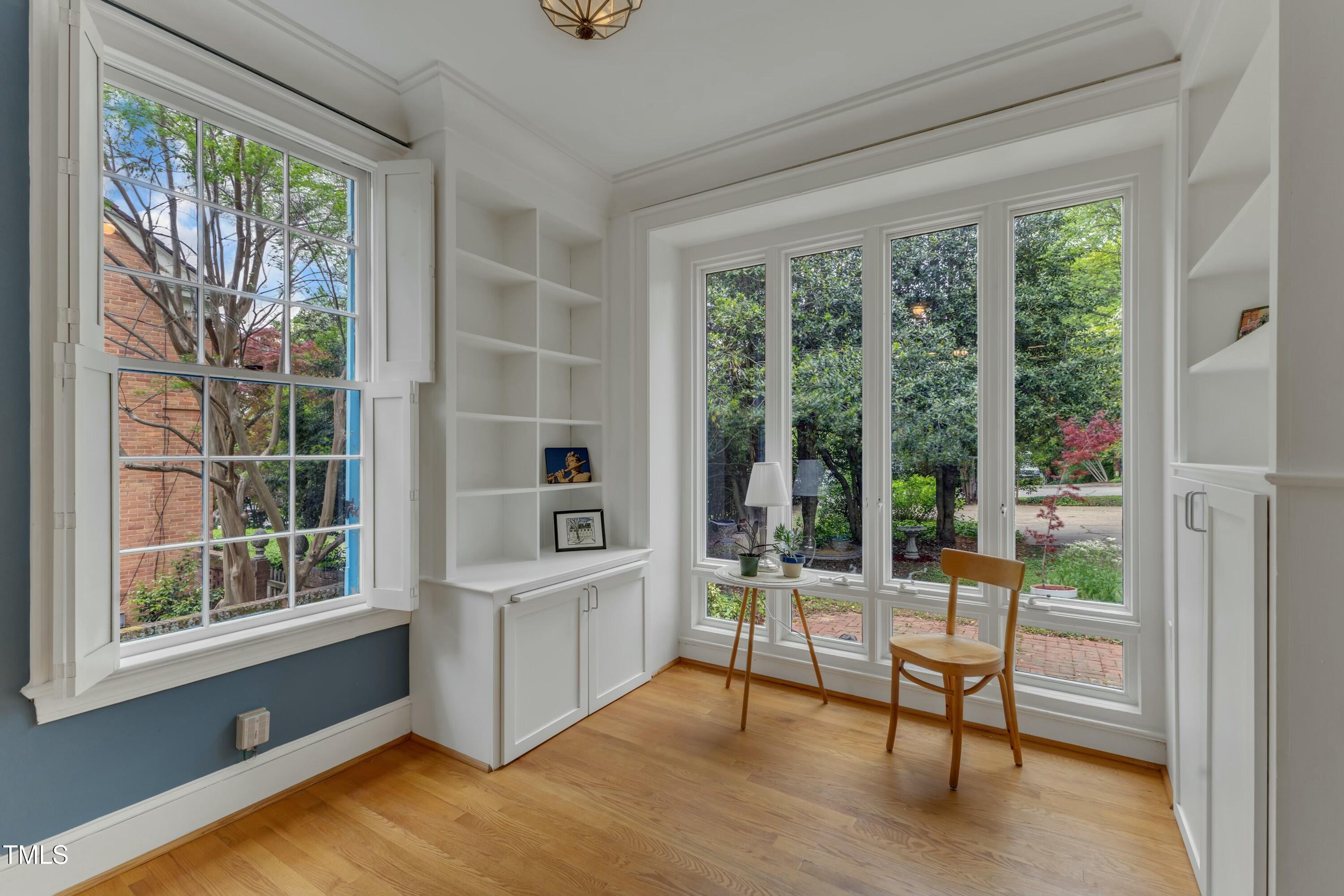 2625 Dover Road Raleigh, NC 27608 - Photo 30 of 90 a living room with hardwood floor and a balcony