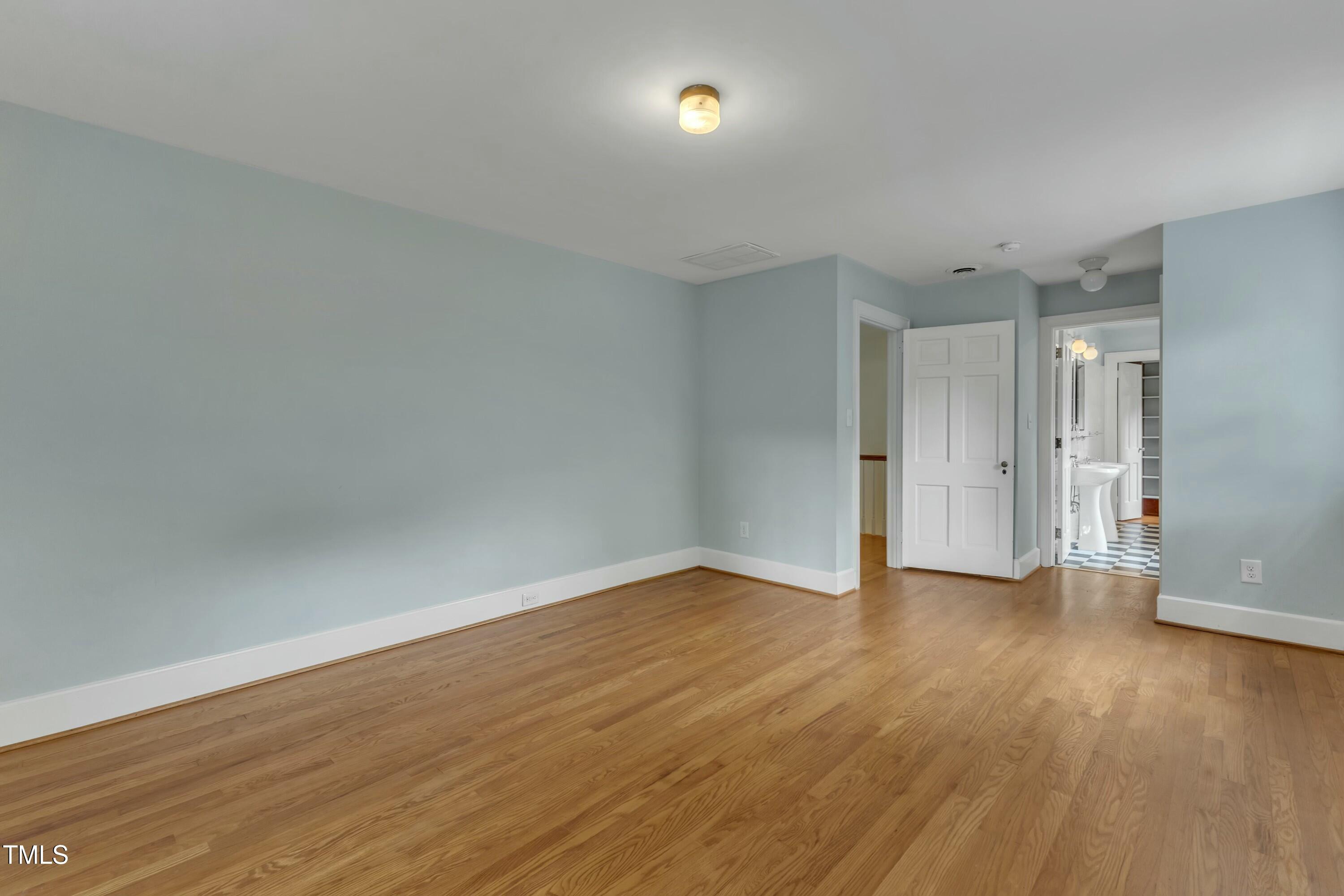 2625 Dover Road Raleigh, NC 27608 - Photo 45 of 90 a view of an empty room with wooden floor