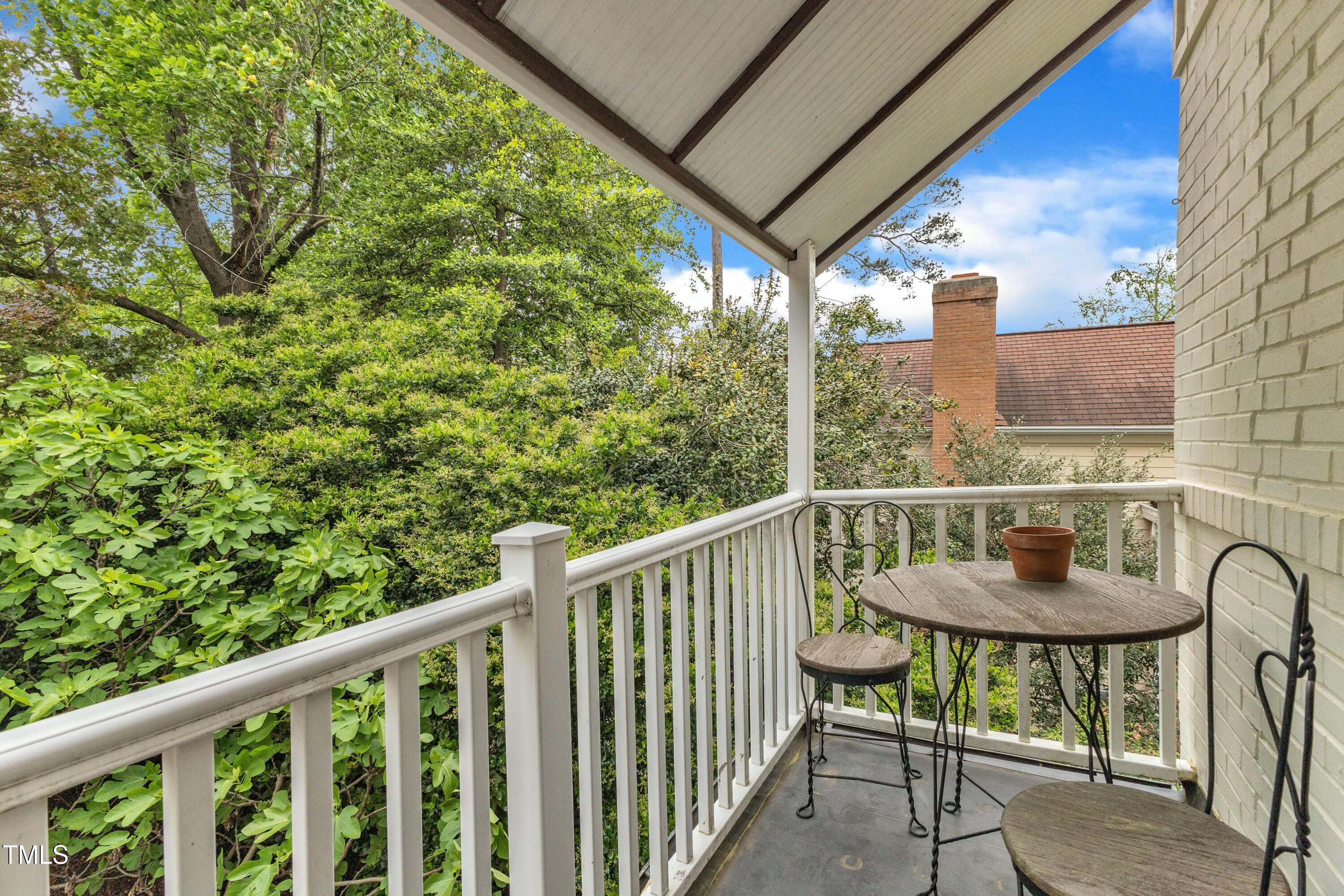 2625 Dover Road Raleigh, NC 27608 - Photo 55 of 90 a view of a chair and table in the balcony