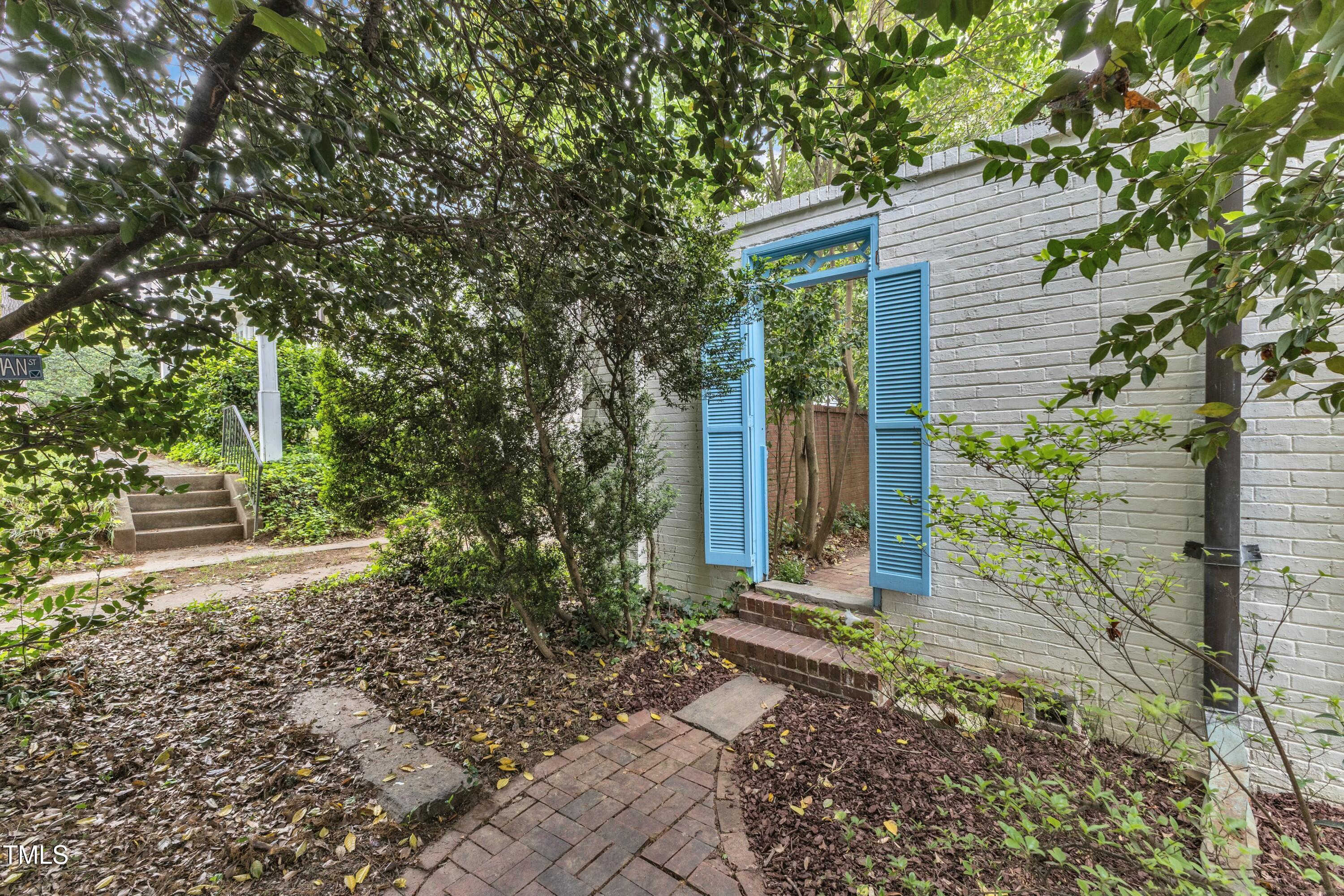 2625 Dover Road Raleigh, NC 27608 - Photo 59 of 90 a front view of a house with garden