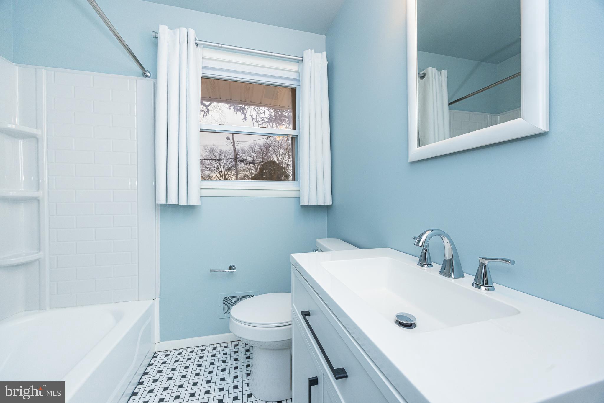 44 Matthew Drive Hamilton, NJ 08690 - Photo 14 of 27 a bathroom with a sink a toilet and shower
