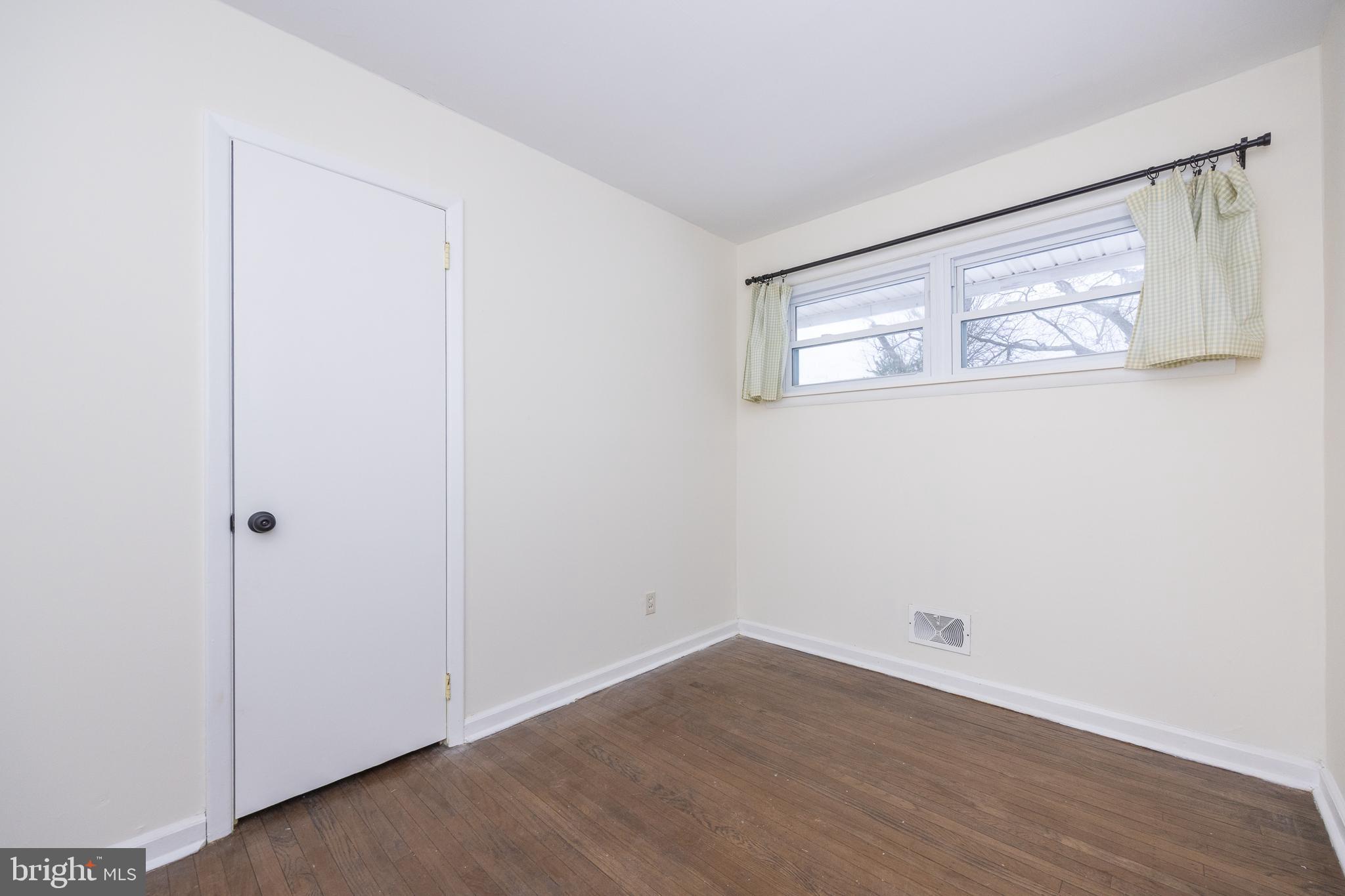 44 Matthew Drive Hamilton, NJ 08690 - Photo 20 of 27 a view of an empty room with wooden floor and closet