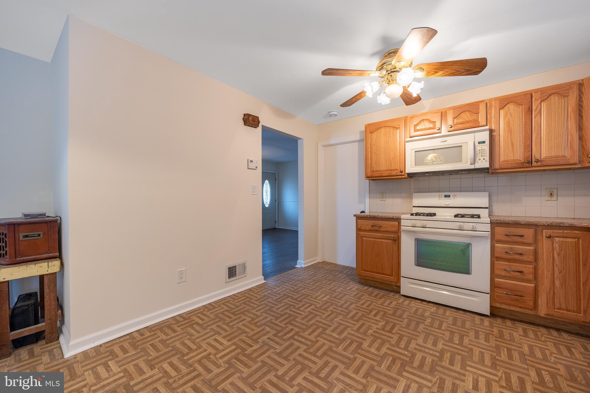 44 Matthew Drive Hamilton, NJ 08690 - Photo 2 of 27 a kitchen with stainless steel appliances granite countertop a stove and a sink