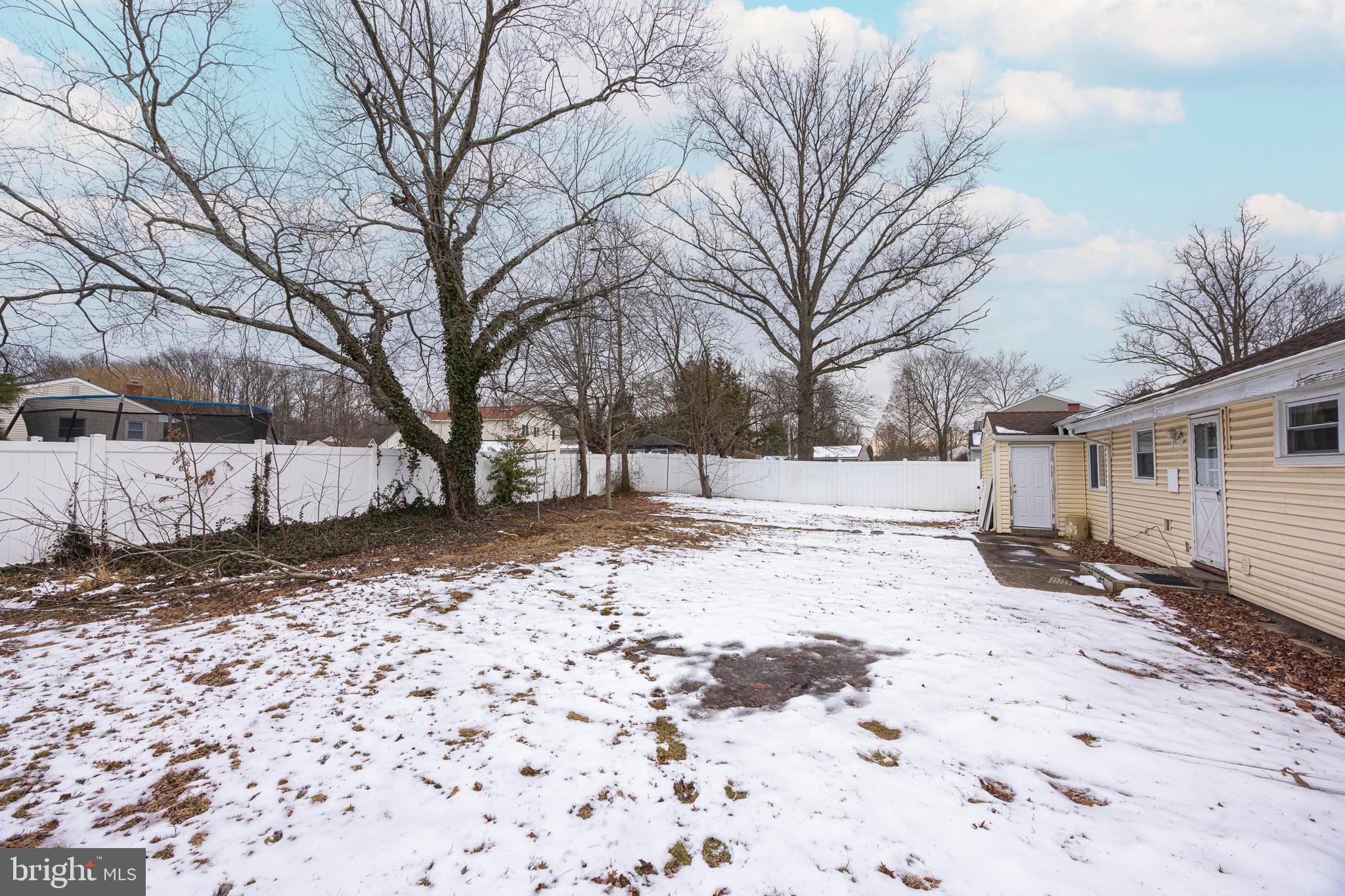 44 Matthew Drive Hamilton, NJ 08690 - Photo 23 of 27 a street view covered with snow