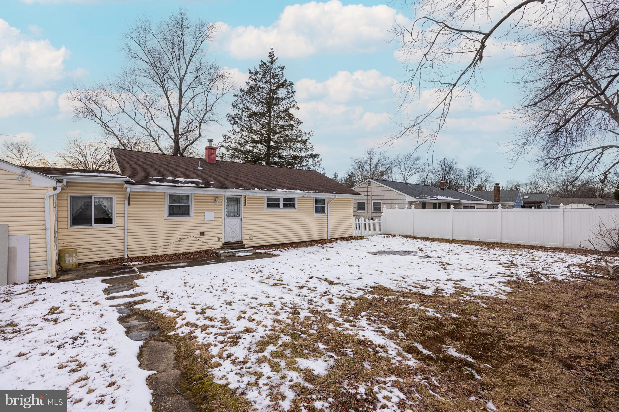 44 Matthew Drive Hamilton, NJ 08690 - Photo 25 of 27 a big white house with a large tree in front of a house