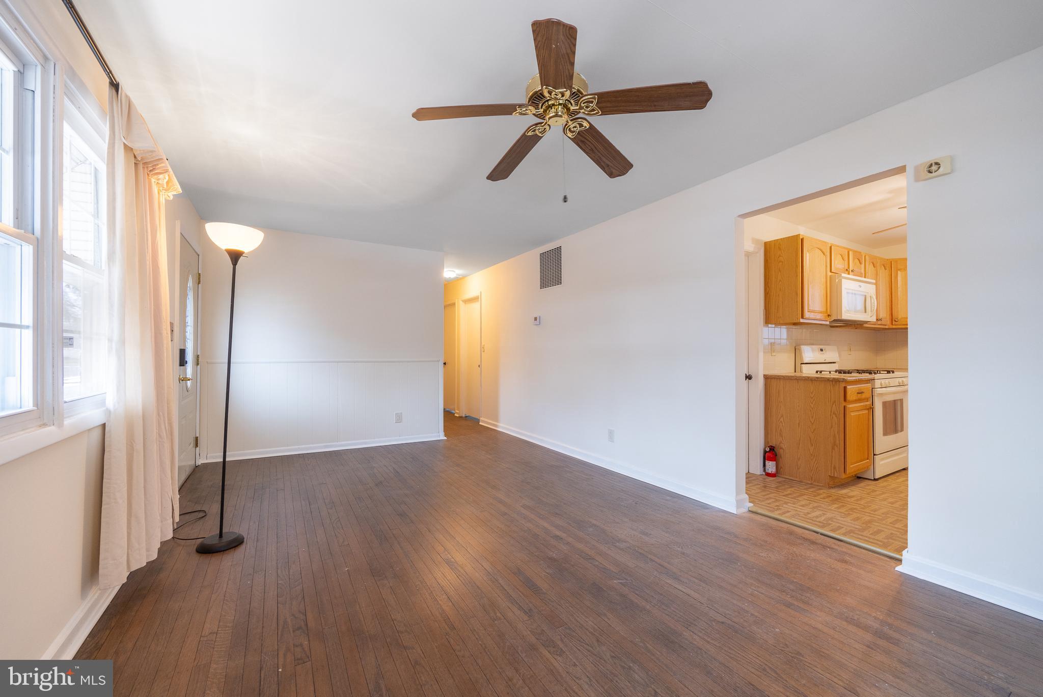 44 Matthew Drive Hamilton, NJ 08690 - Photo 4 of 27 a view of empty room with wooden floor and fan