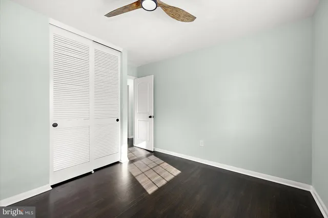 an empty room with wooden floor