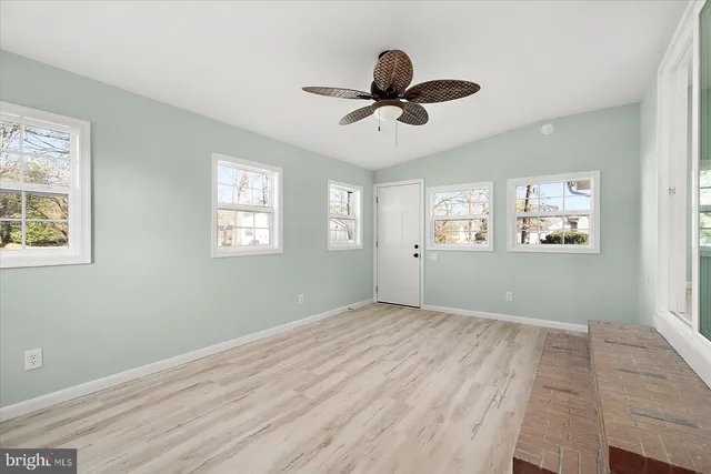 a view of empty room with windows