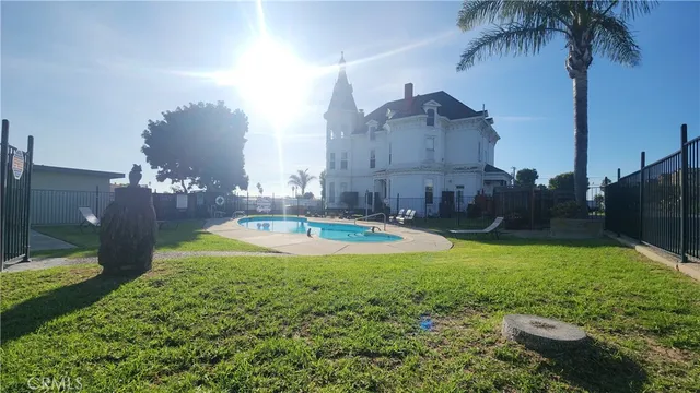 a view of a swimming pool and a yard