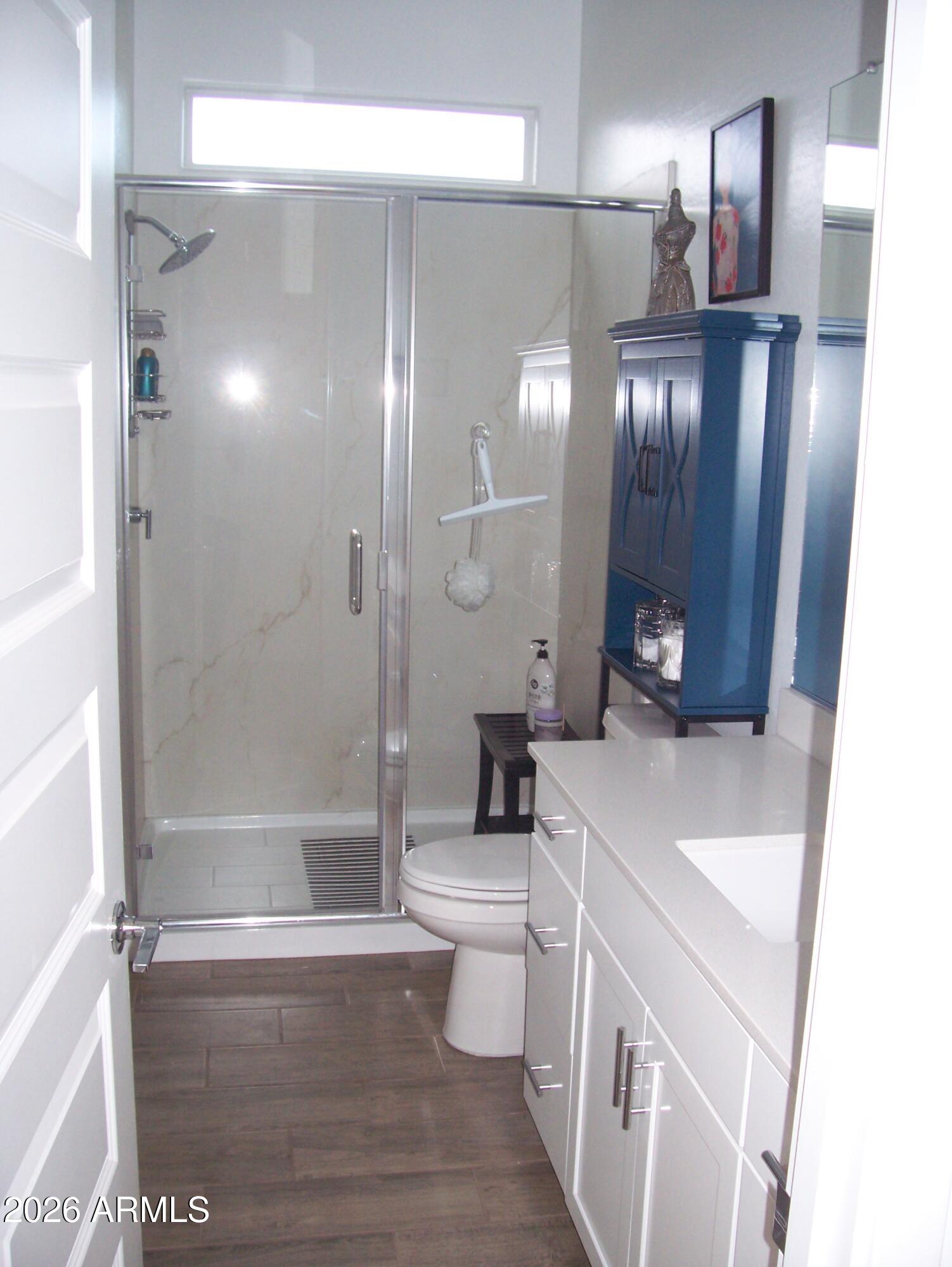 3255 West Peak View Road Phoenix, AZ 85083 - Photo 13 of 46 a bathroom with a sink a toilet a mirror and shower