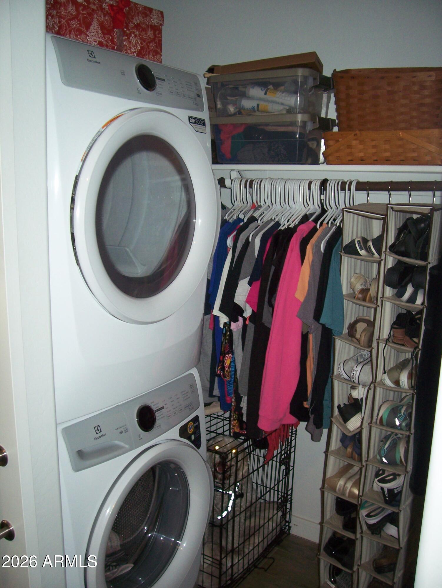 3255 West Peak View Road Phoenix, AZ 85083 - Photo 15 of 46 a view of walk in closet with clothes and shoes