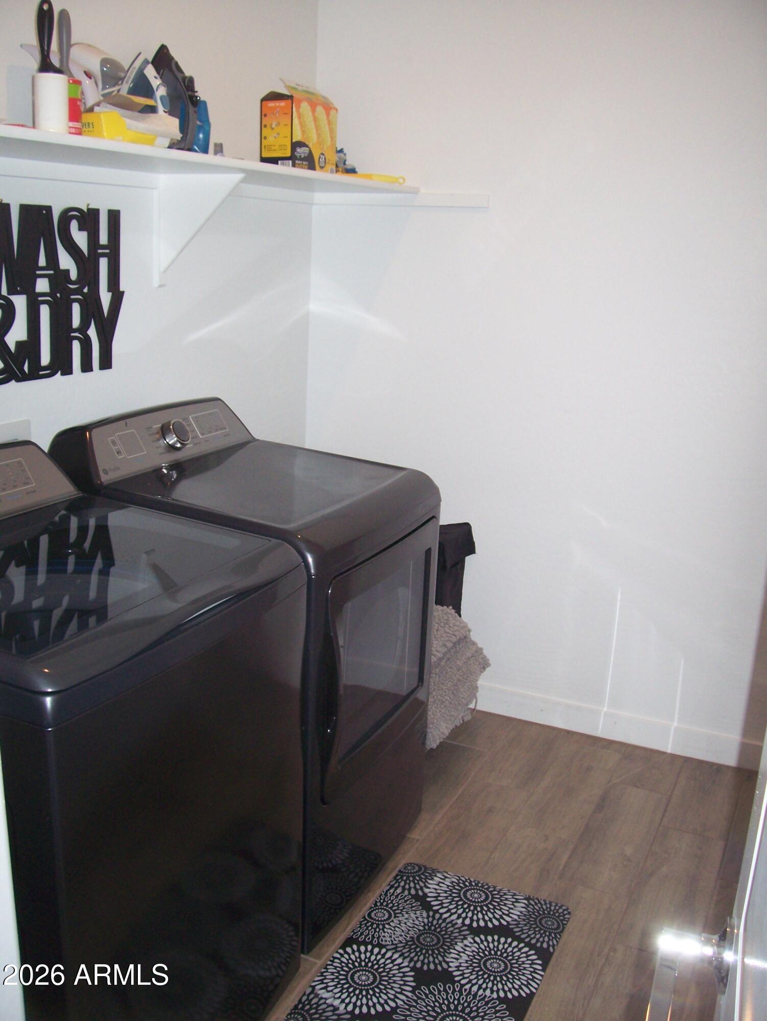 3255 West Peak View Road Phoenix, AZ 85083 - Photo 20 of 46 a utility room with dryer and washer