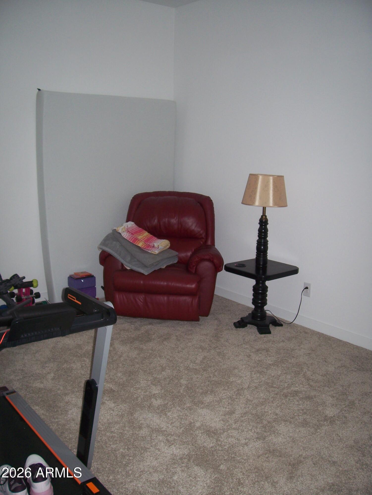 3255 West Peak View Road Phoenix, AZ 85083 - Photo 21 of 46 a room with a couch and a potted plant