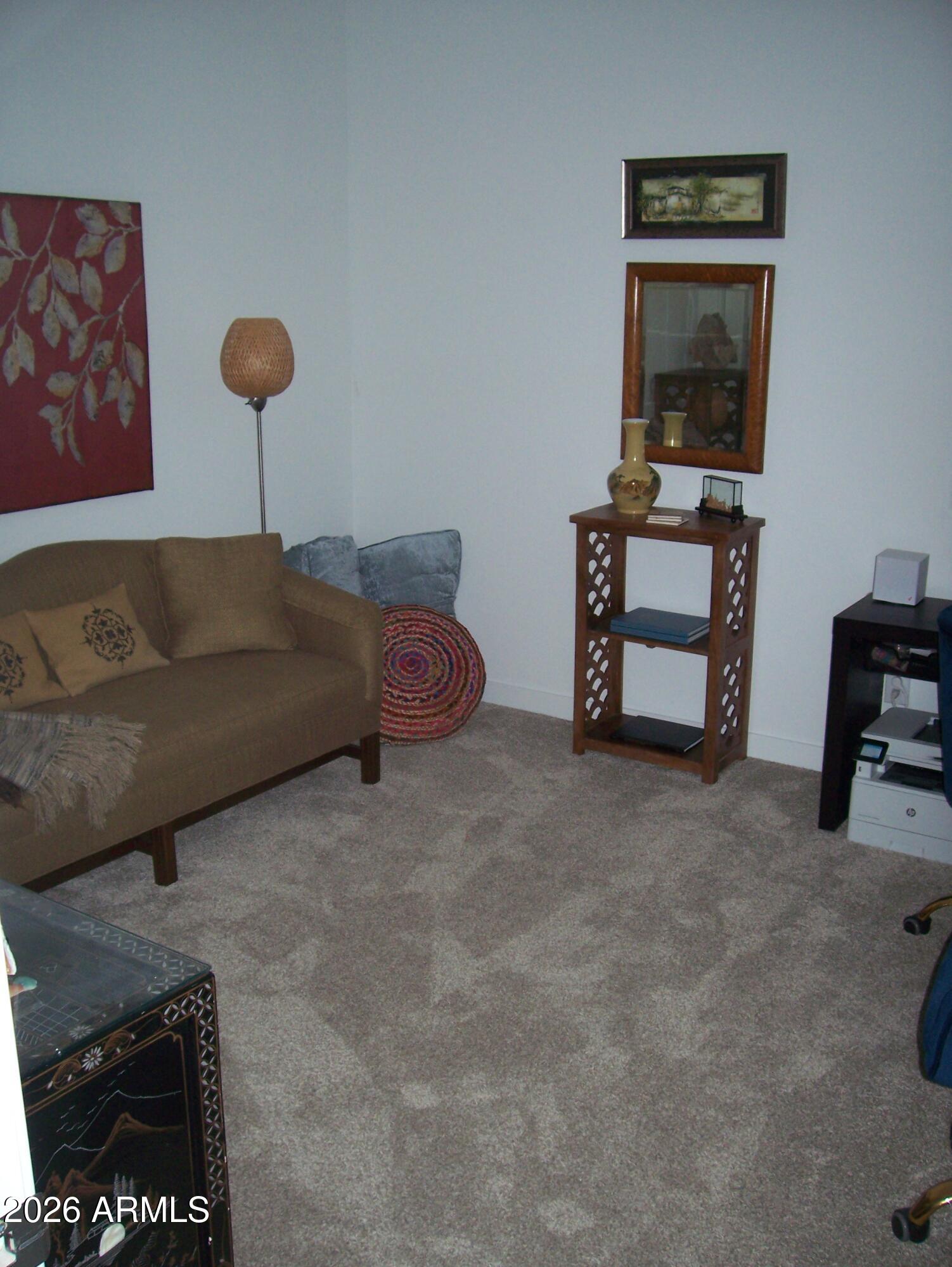 3255 West Peak View Road Phoenix, AZ 85083 - Photo 22 of 46 a living room with furniture and a lamp