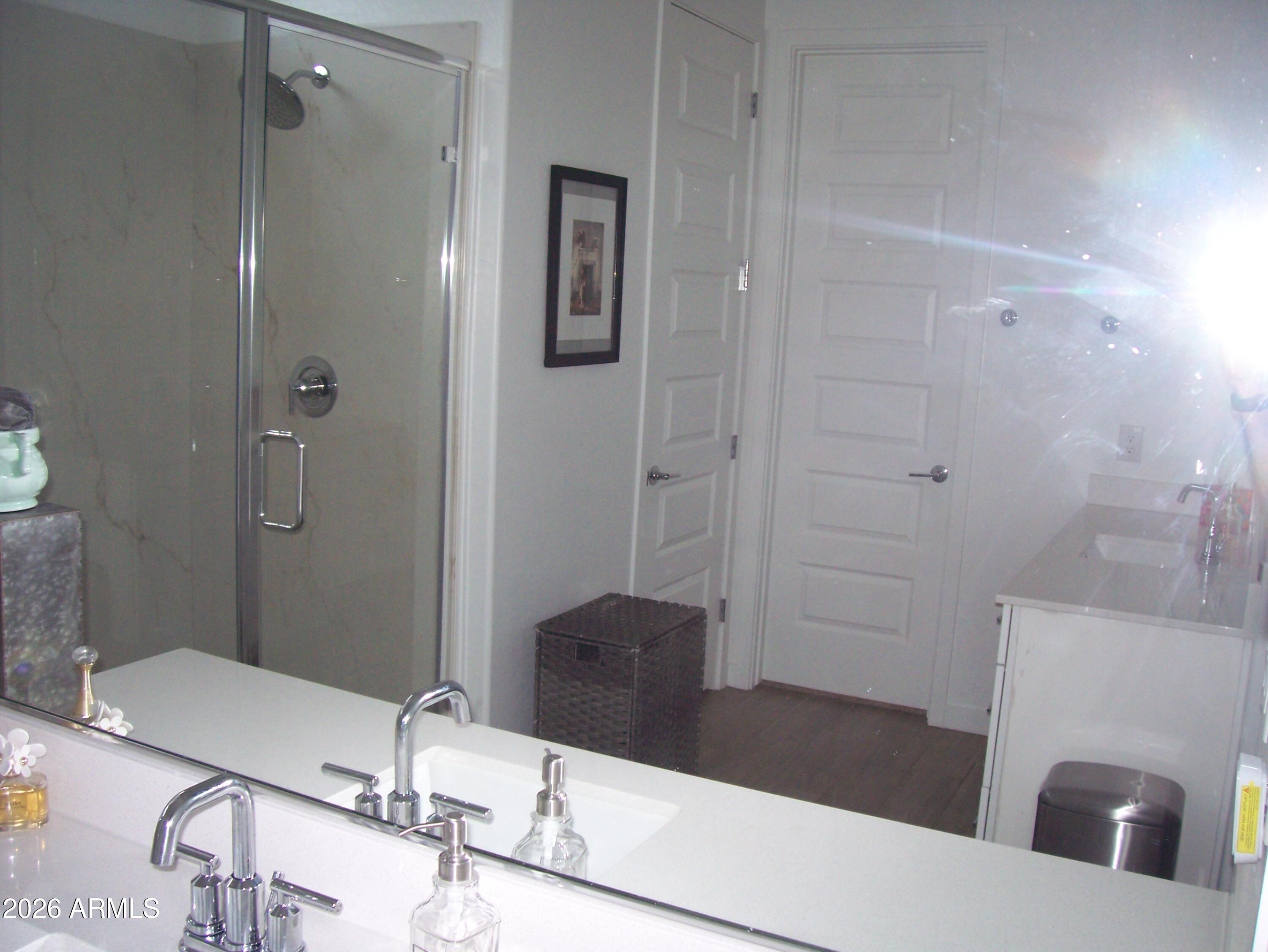 3255 West Peak View Road Phoenix, AZ 85083 - Photo 26 of 46 a bathroom with a granite countertop sink a mirror and shower