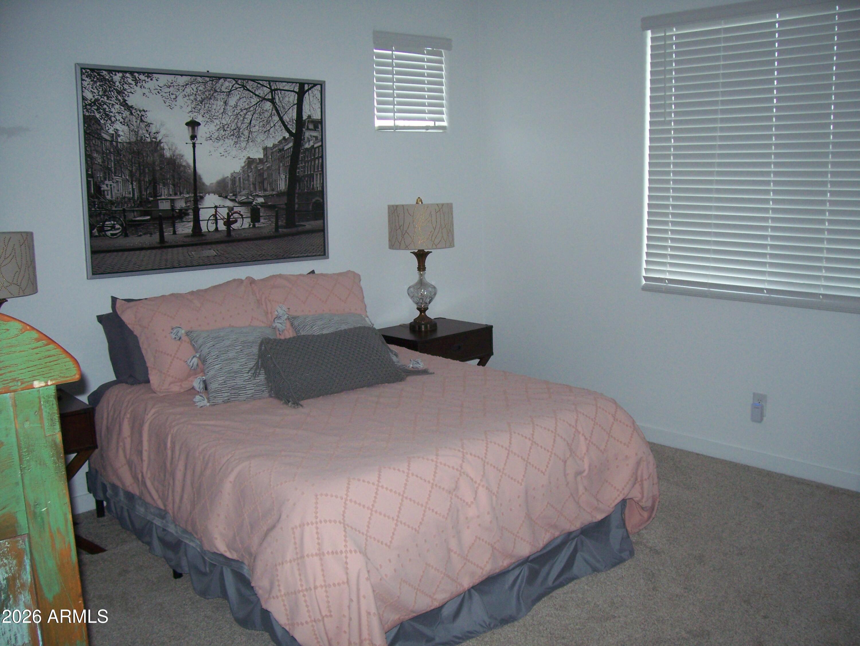 3255 West Peak View Road Phoenix, AZ 85083 - Photo 27 of 46 a bedroom with a bed and wall painting
