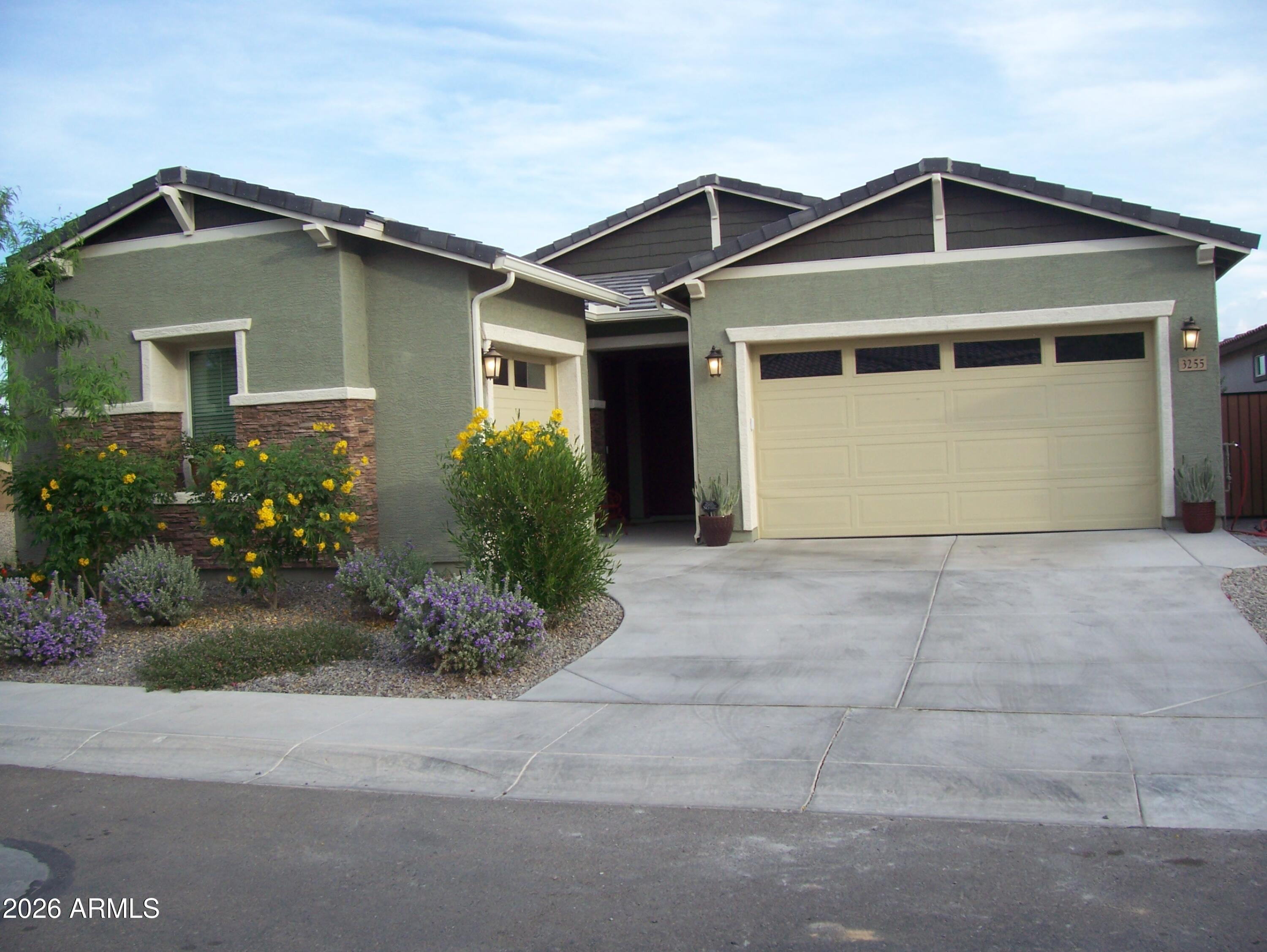 3255 West Peak View Road Phoenix, AZ 85083 - Photo 39 of 46 a front view of a house with garden