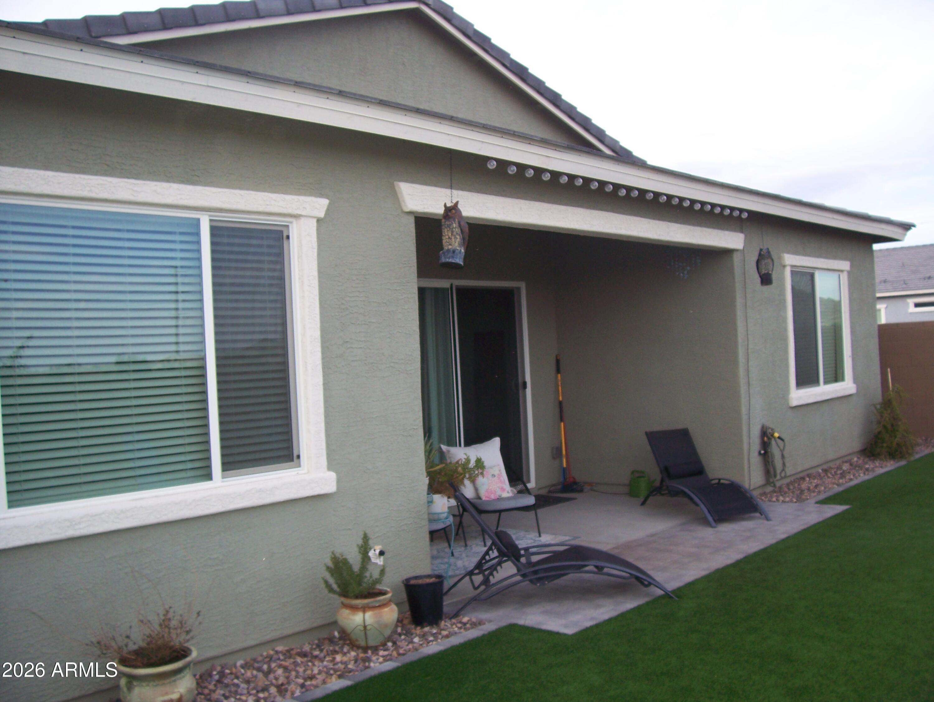 3255 West Peak View Road Phoenix, AZ 85083 - Photo 45 of 46 a front view of a house with a garden