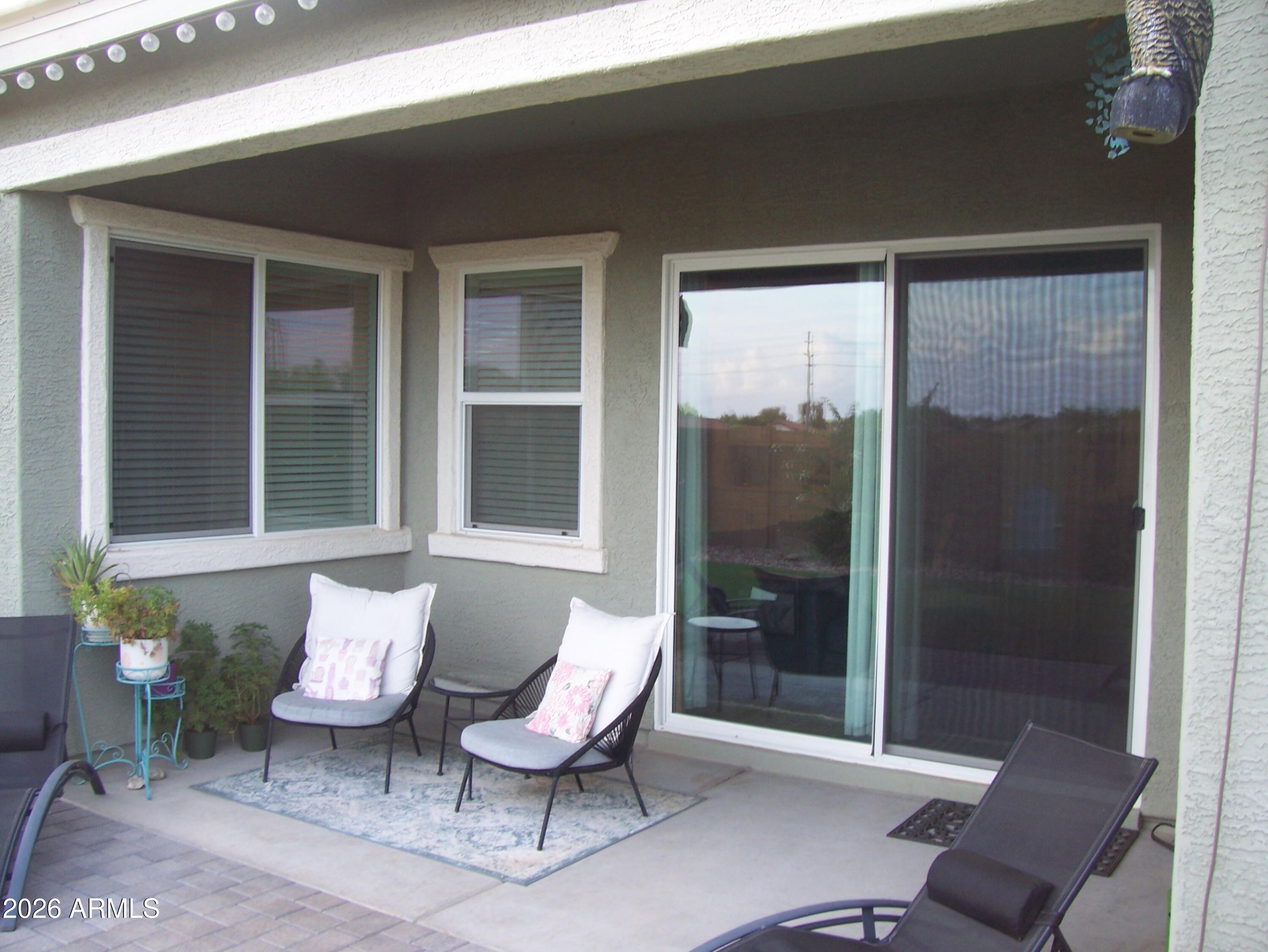 3255 West Peak View Road Phoenix, AZ 85083 - Photo 6 of 46 a balcony with furniture and a potted plant