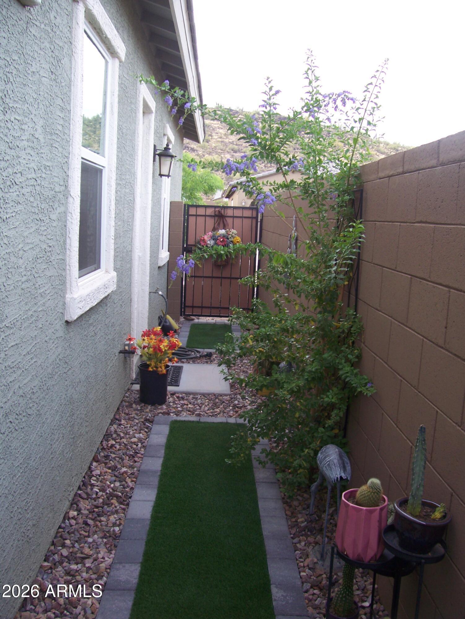 3255 West Peak View Road Phoenix, AZ 85083 - Photo 9 of 46 a view of a porch with furniture and a yard