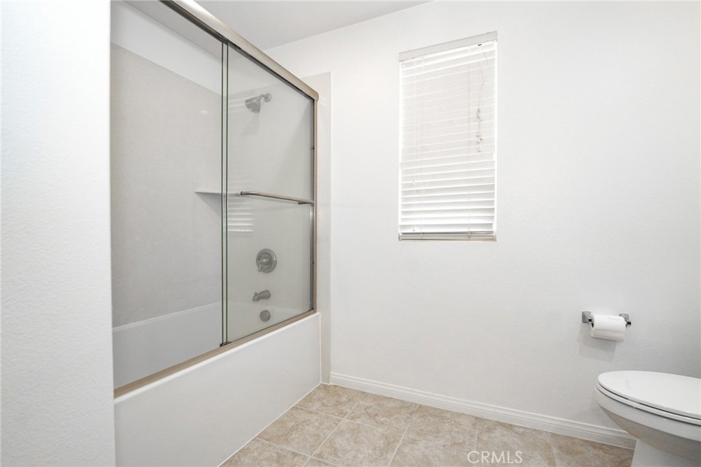 31 Bell Chime Irvine, CA 92618 - Photo 20 of 28 a bathroom with a bathtub a toilet and a shower