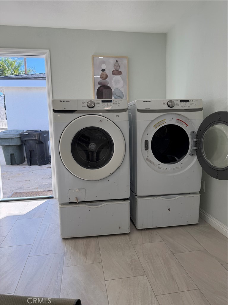 31 Bell Chime Irvine, CA 92618 - Photo 23 of 28 a utility room with dryer and washer