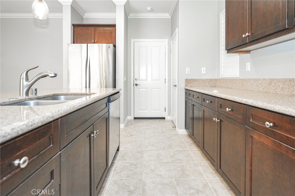 31 Bell Chime Irvine, CA 92618 - Photo 6 of 28 a kitchen with granite countertop a sink and cabinets