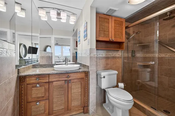 a bathroom with a shower and toilet