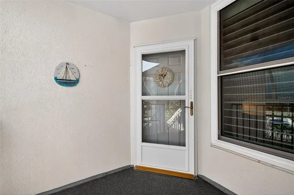 a view of a room with workspace and wooden floor