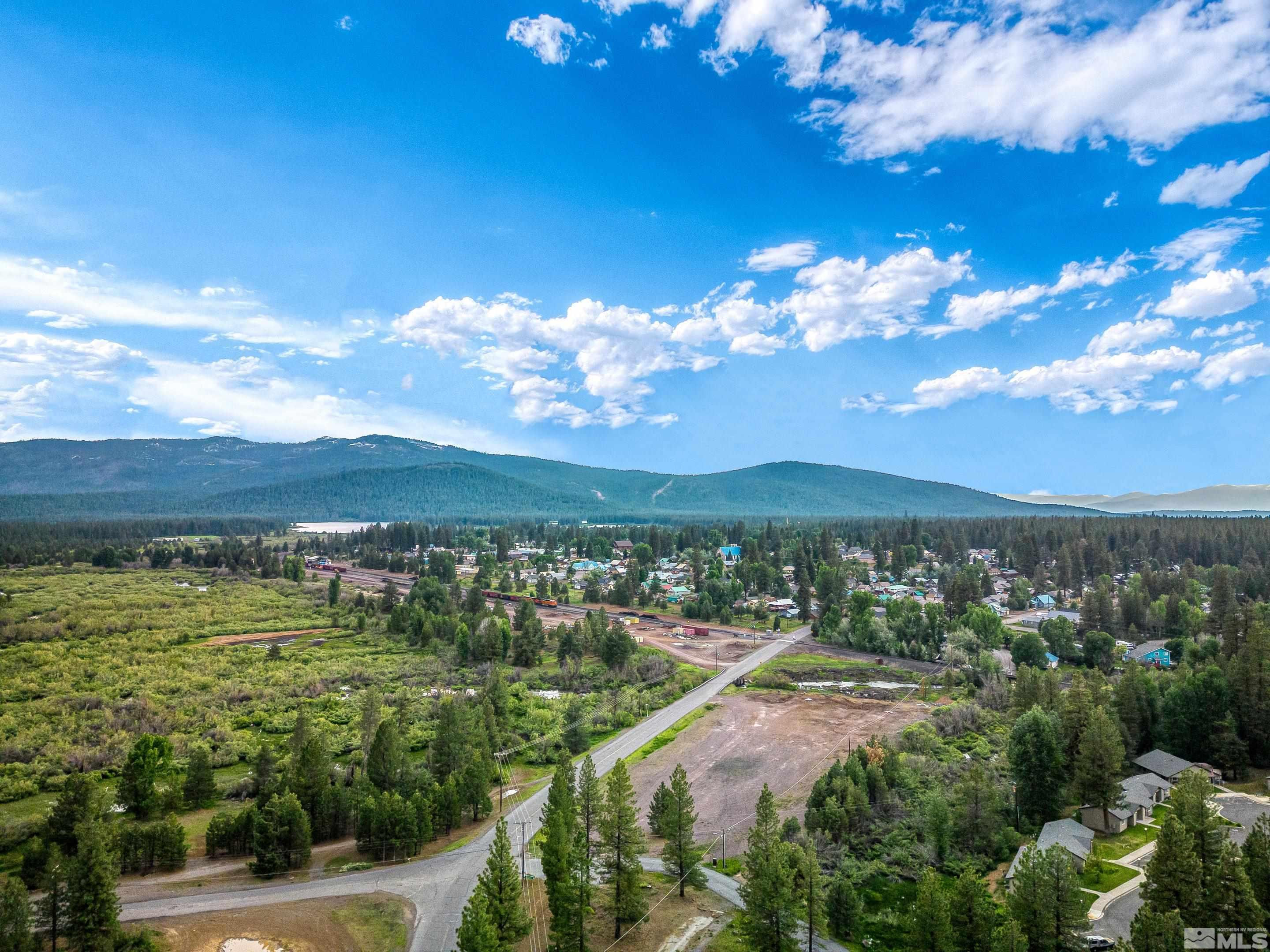 671-295 Mooney Road, Unit A21 Westwood, CA 96130 - Photo 2 of 20 a view of a city with lots of residential buildings ocean and mountain view in back