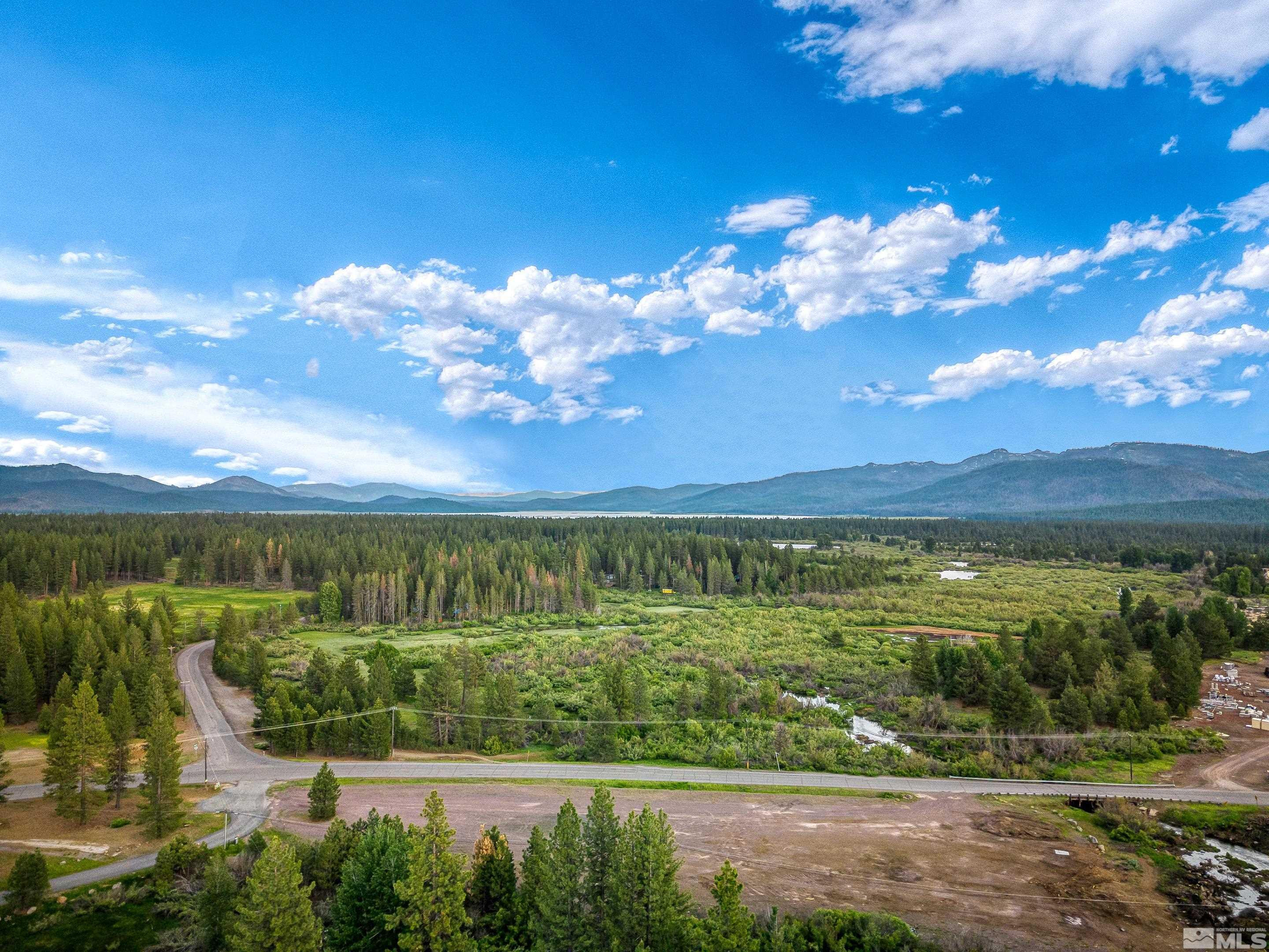 671-295 Mooney Road, Unit A21 Westwood, CA 96130 - Photo 6 of 20 a view of a lake with a mountain in the background