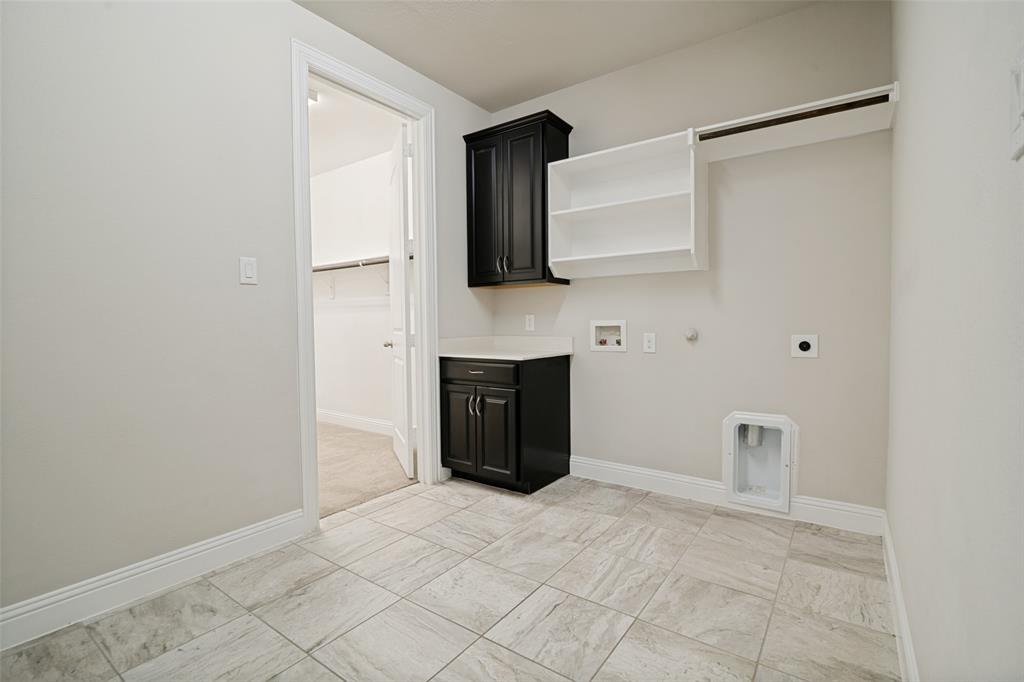2802 Merlot Circle Rowlett, TX 75088 - Photo 24 of 40 a view of a livingroom with a fireplace and cabinet
