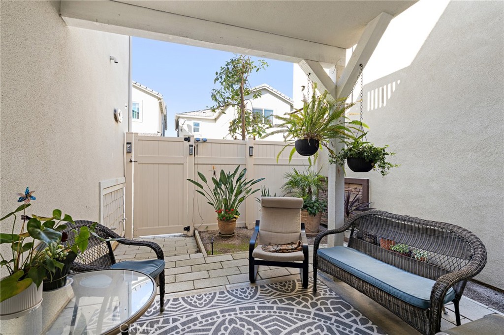 20 Edgemont Compton, CA 90221 - Photo 22 of 25 a living room filled with furniture and a potted plant