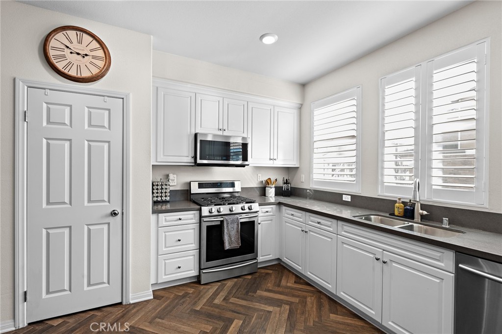 20 Edgemont Compton, CA 90221 - Photo 9 of 25 a kitchen with a sink a stove and cabinets