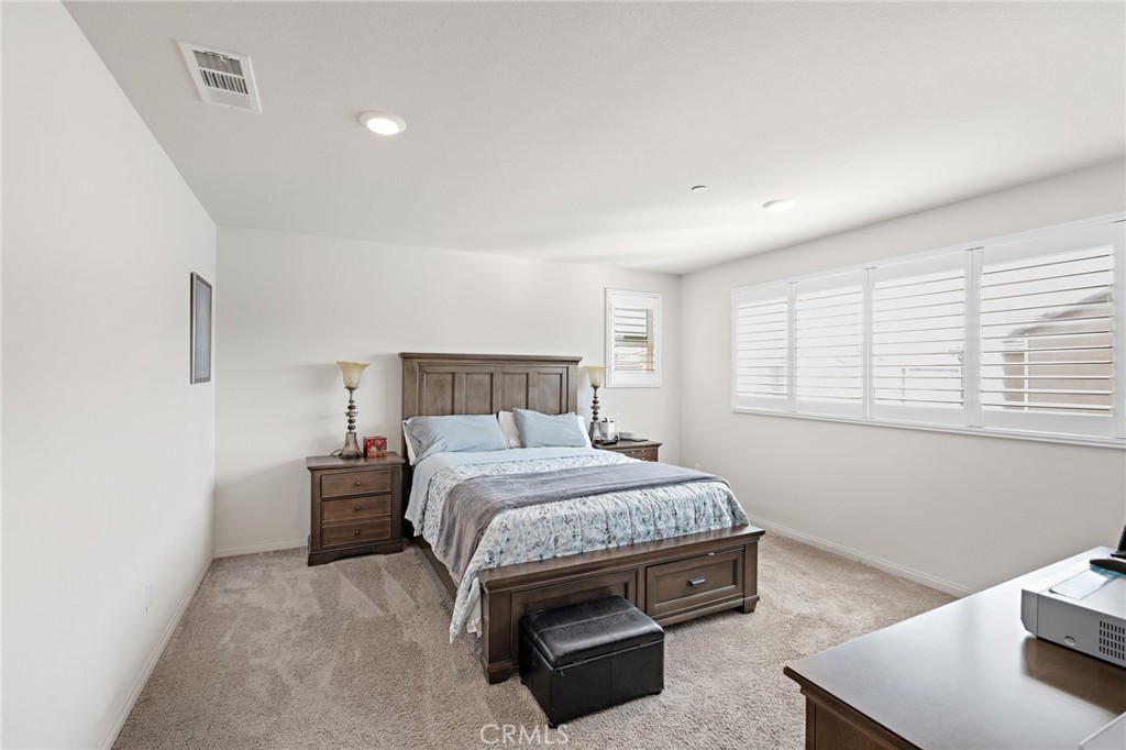 20 Edgemont Compton, CA 90221 - Photo 10 of 25 a bedroom with a bed and a table in it