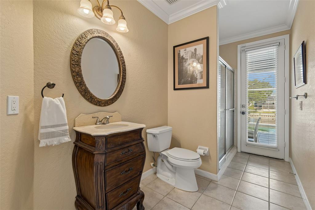 703 Bunker View Drive Apollo Beach, FL 33572 - Photo 18 of 49 a bathroom with a toilet a sink and mirror
