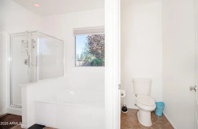 a bathroom with a toilet sink and a shower