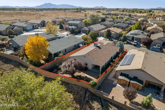 an aerial view of a house with lake view
