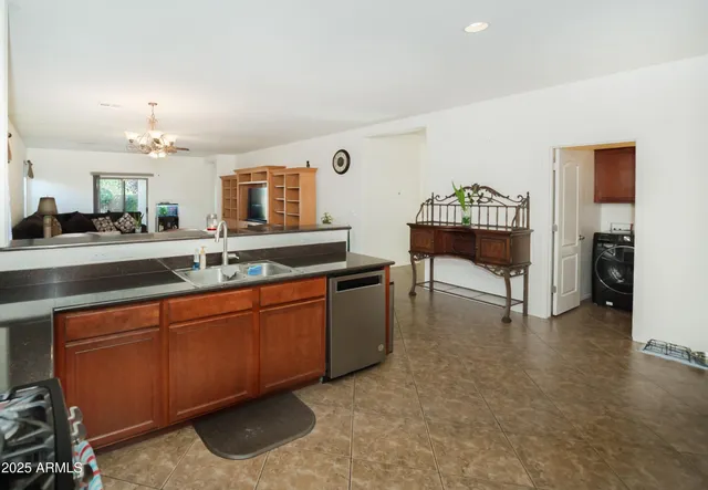 a spacious bathroom with a sink and a mirror