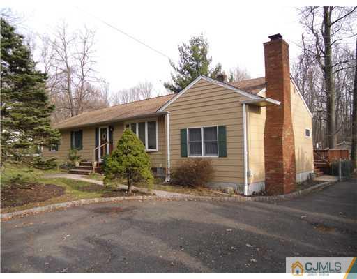 242 New Road Monmouth Junction, NJ 08852 - Photo 1 of 11 a front view of a house with garden