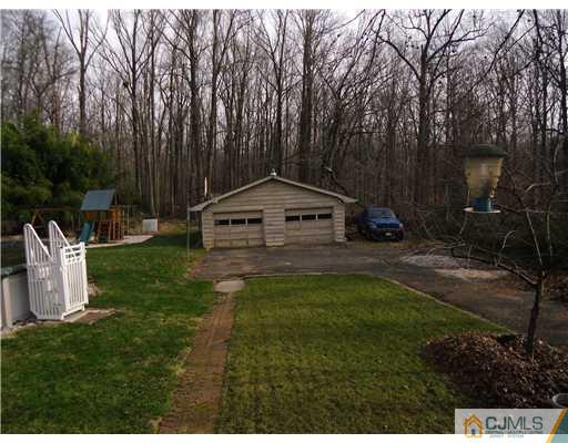 242 New Road Monmouth Junction, NJ 08852 - Photo 11 of 11 a view of a tiny house with garden