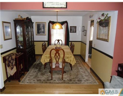 242 New Road Monmouth Junction, NJ 08852 - Photo 4 of 11 a living room with furniture and a mirror